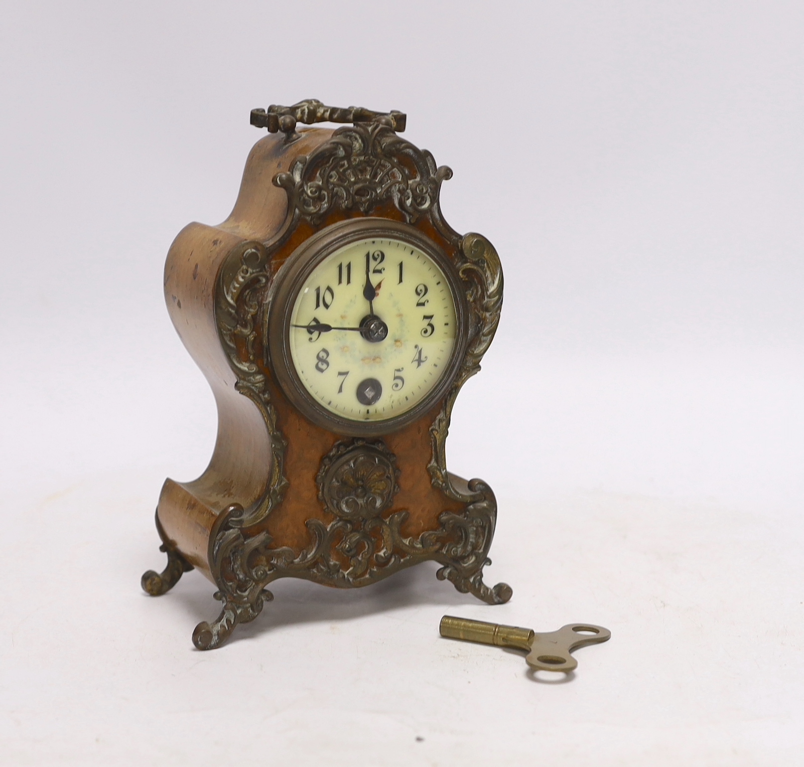 A small brass mounted mantel timepiece, German movement, with key, 18cm